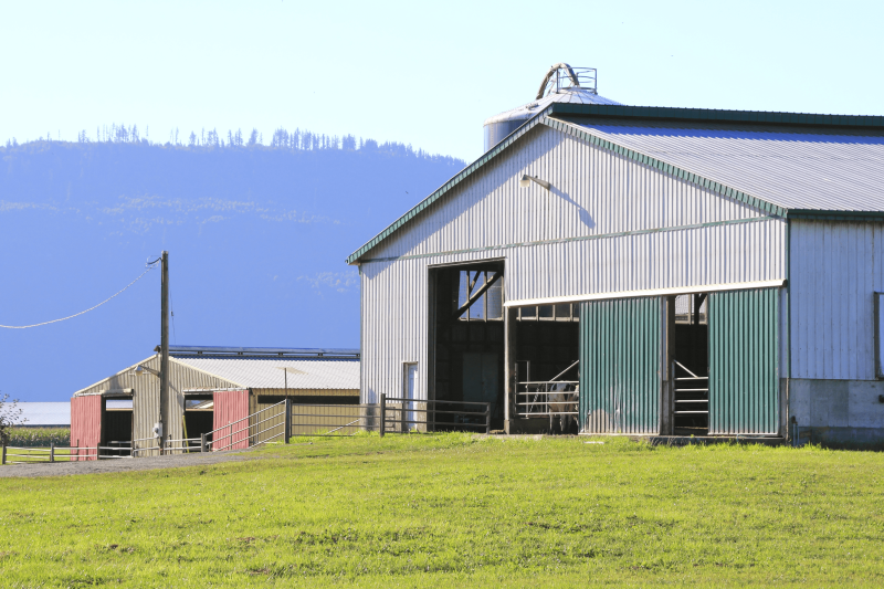 Outside view of a stables building on a farm.