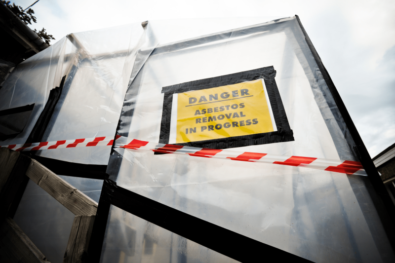 Danger Asbestos Removal in Progress sign.