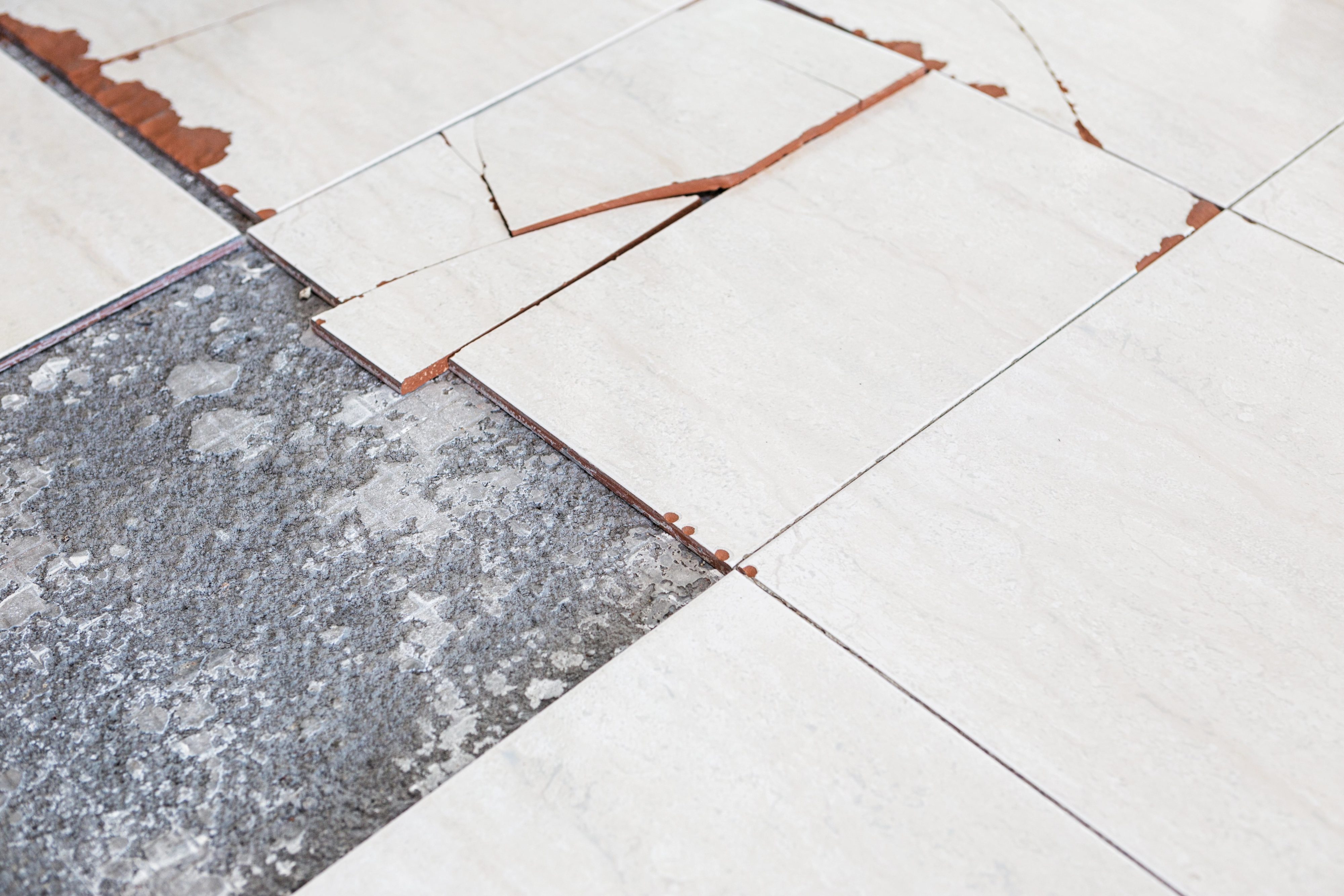 Chipped asbestos floor tiles.