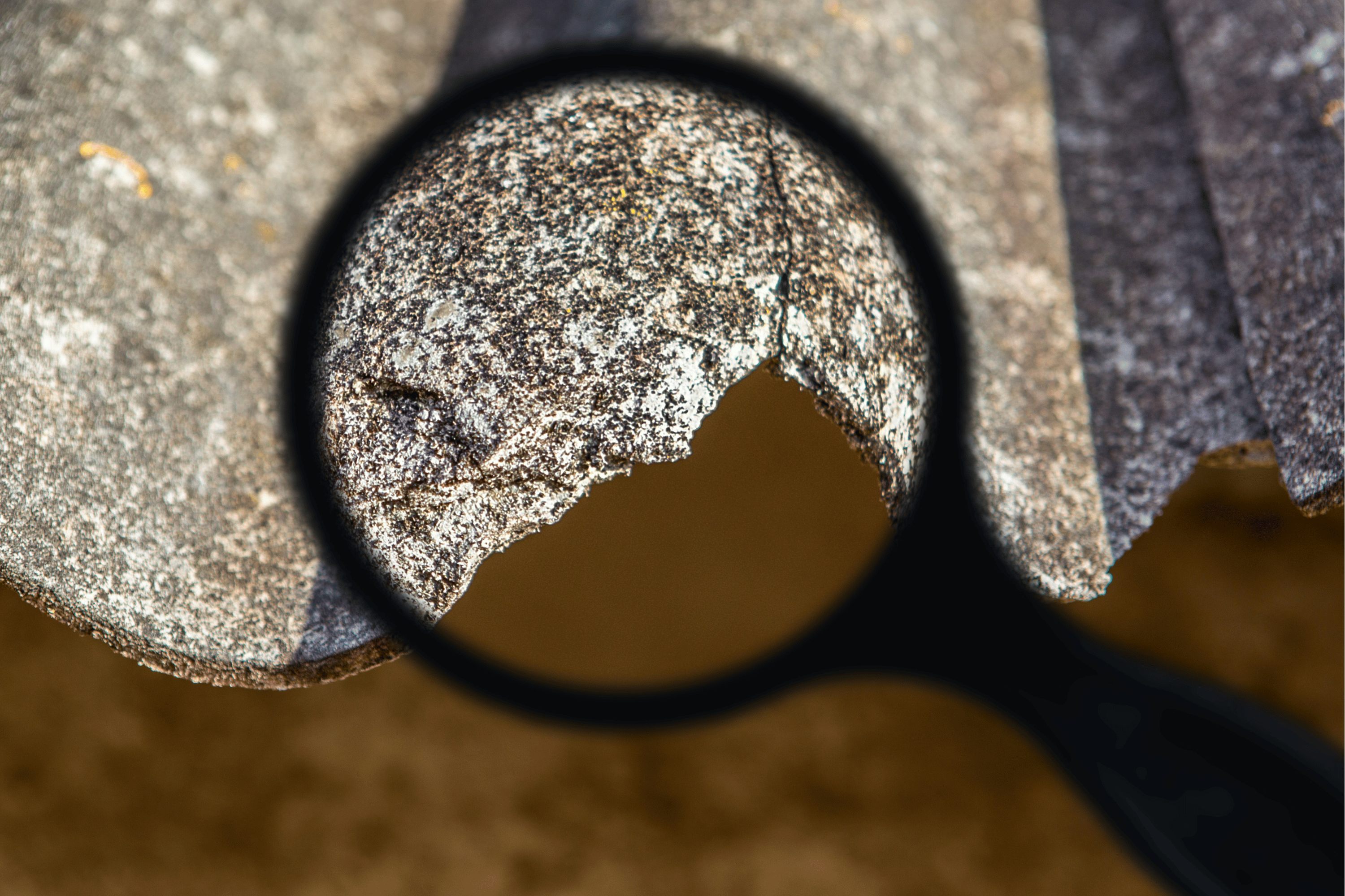 asbestos with magnifying glass